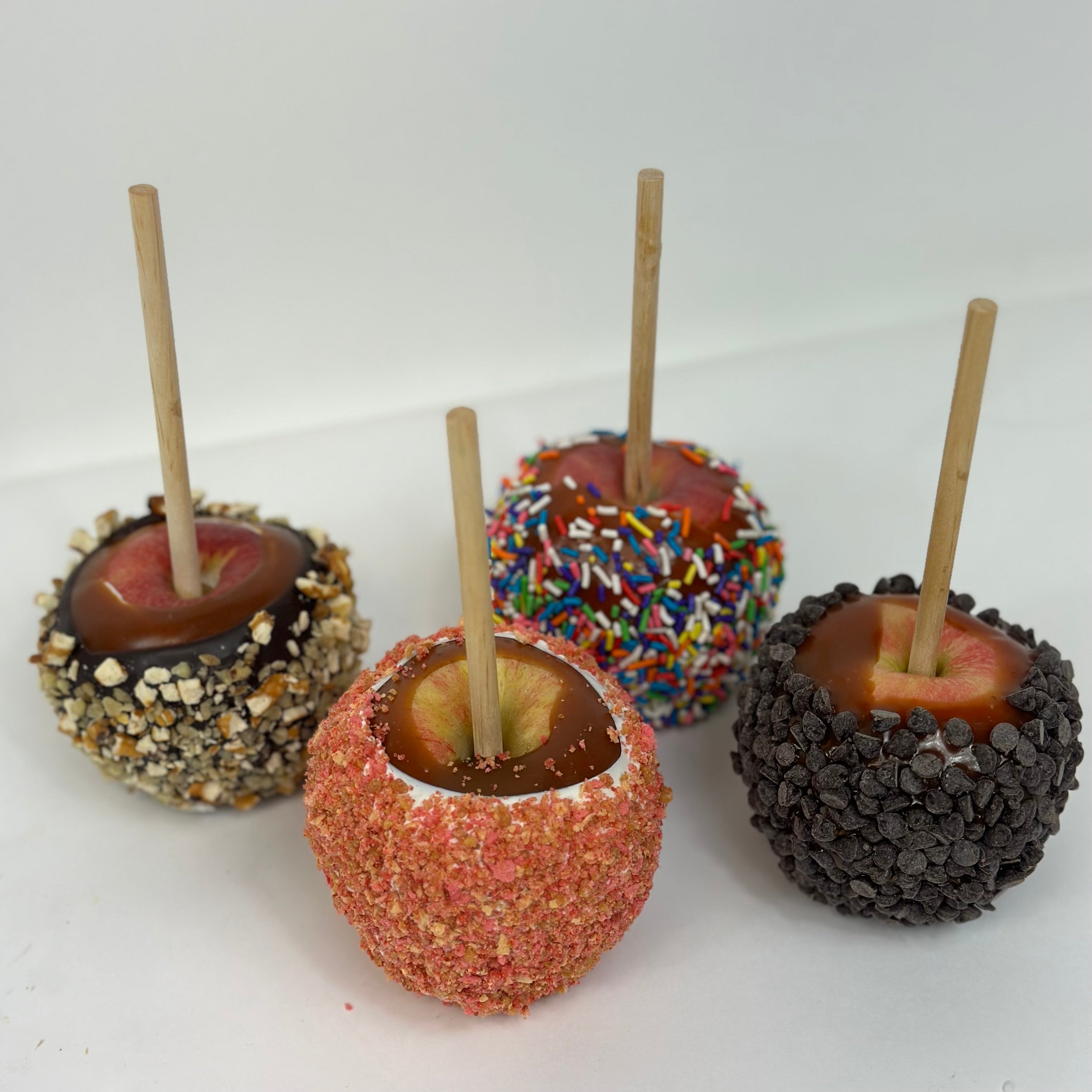 Four Caramel Apples. Each has it's own flavor: Walnut, Strawberry Crunch, Chocolate Chip, and Sprinkles.