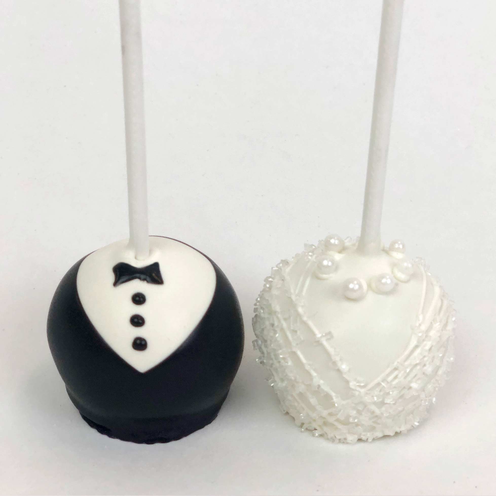 Bride's white dress and Groom's black and white tuxedo Cake pops