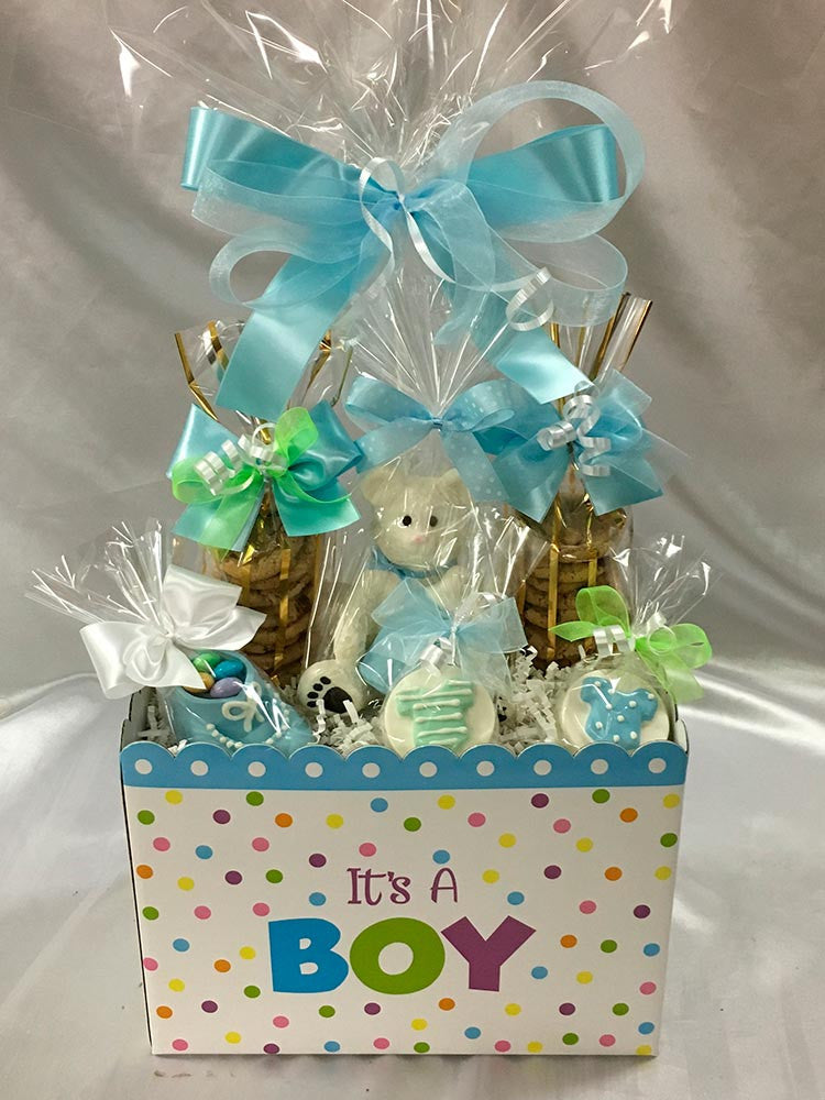 It's A boy git box: 2 bags of mini chocolate chip cookies, solid 3D white chocolate bear, chocolate baby bootie, and 2 chocolate covered Oreos all wrapped in cello and tied with Rosa Wrap satin bow.