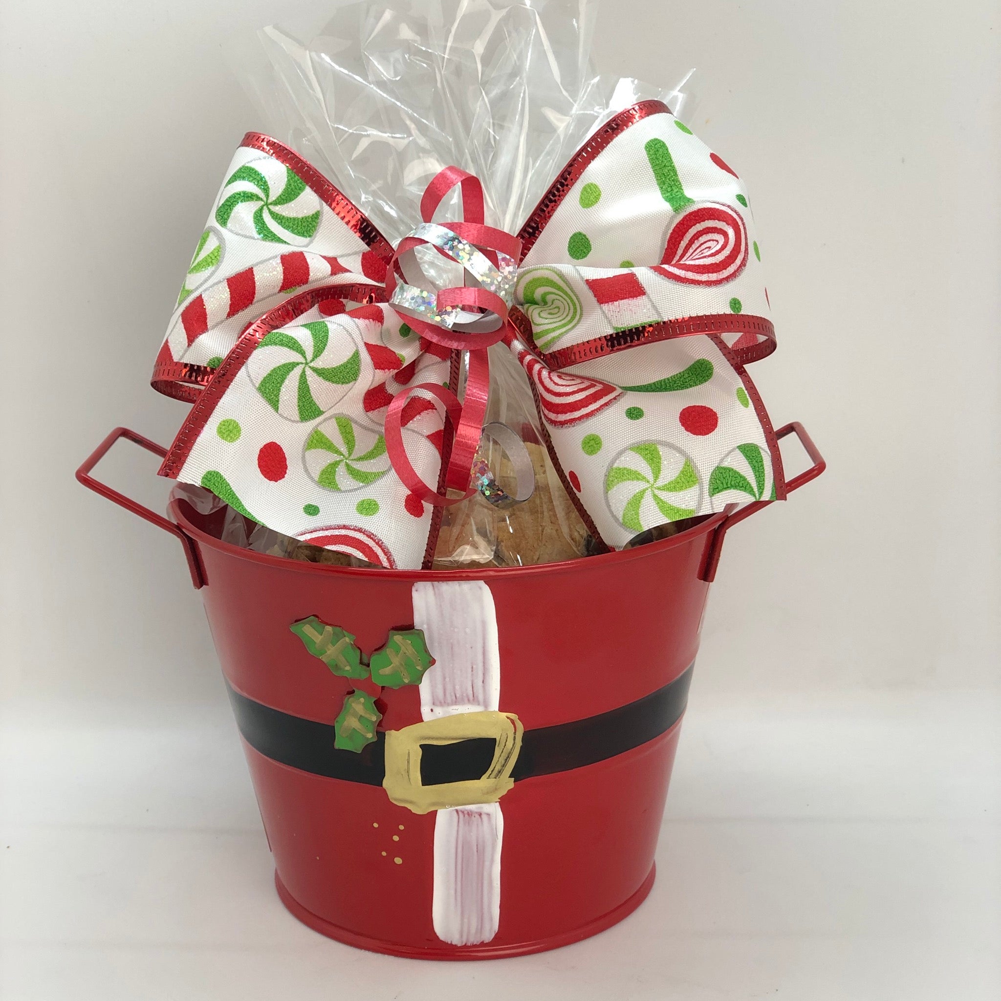 Santa's Cookies in a red bucket wrapped in cellophane with a ribbon