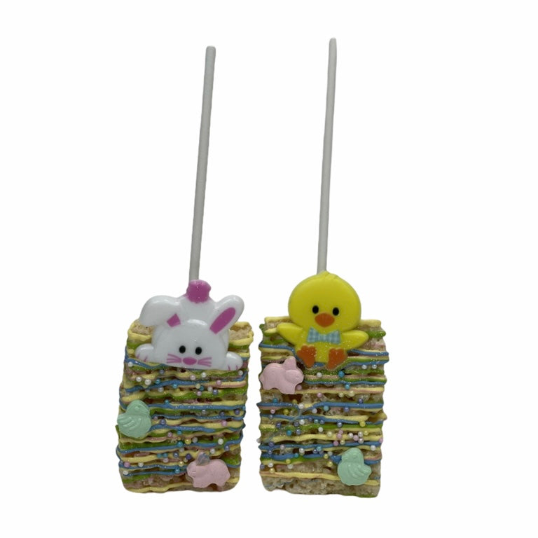 A Bunny and a Chick Rice Krispy Treats next to each other, each has a stick,
