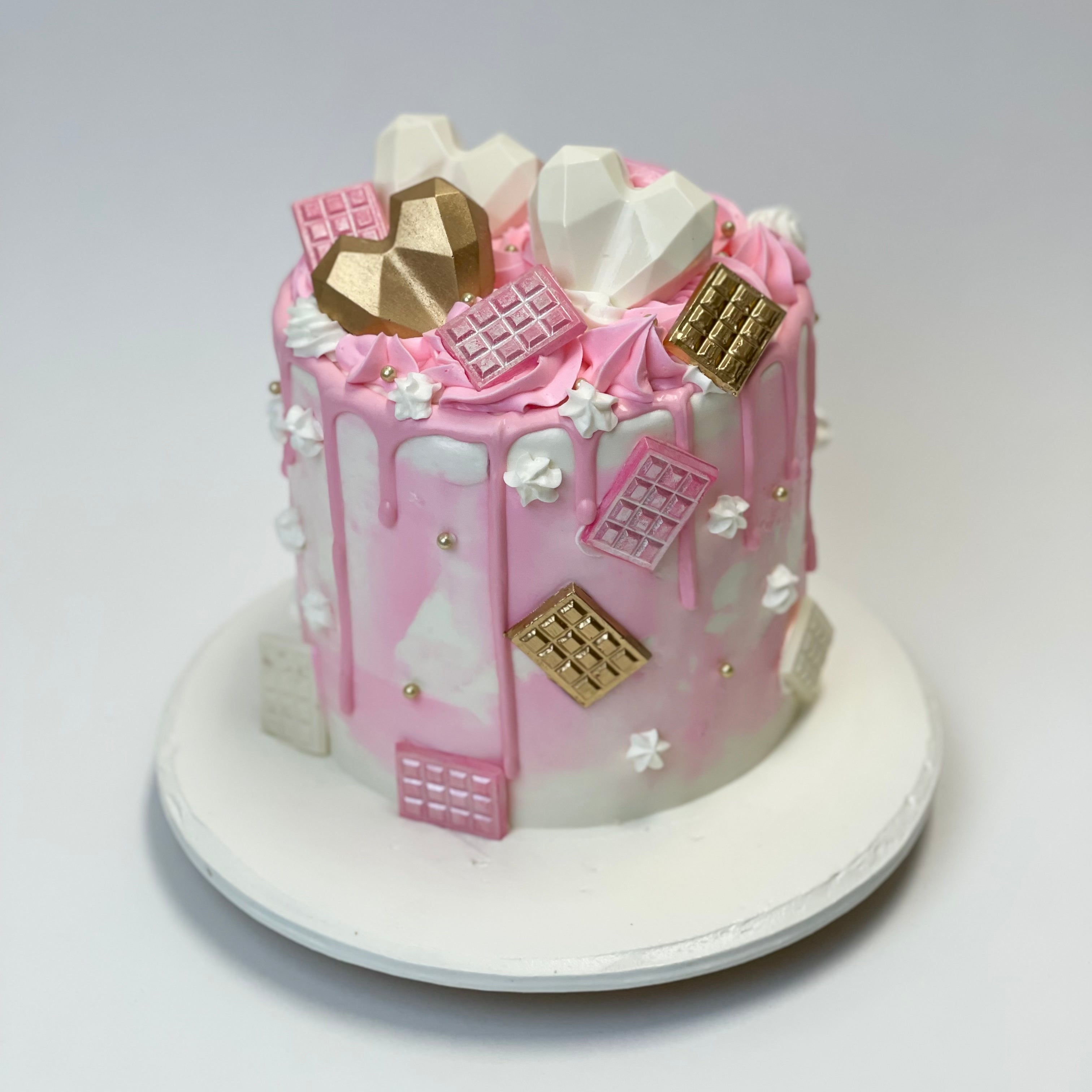 White and pink Watercolor Celebration Cake with white and gold hearts
