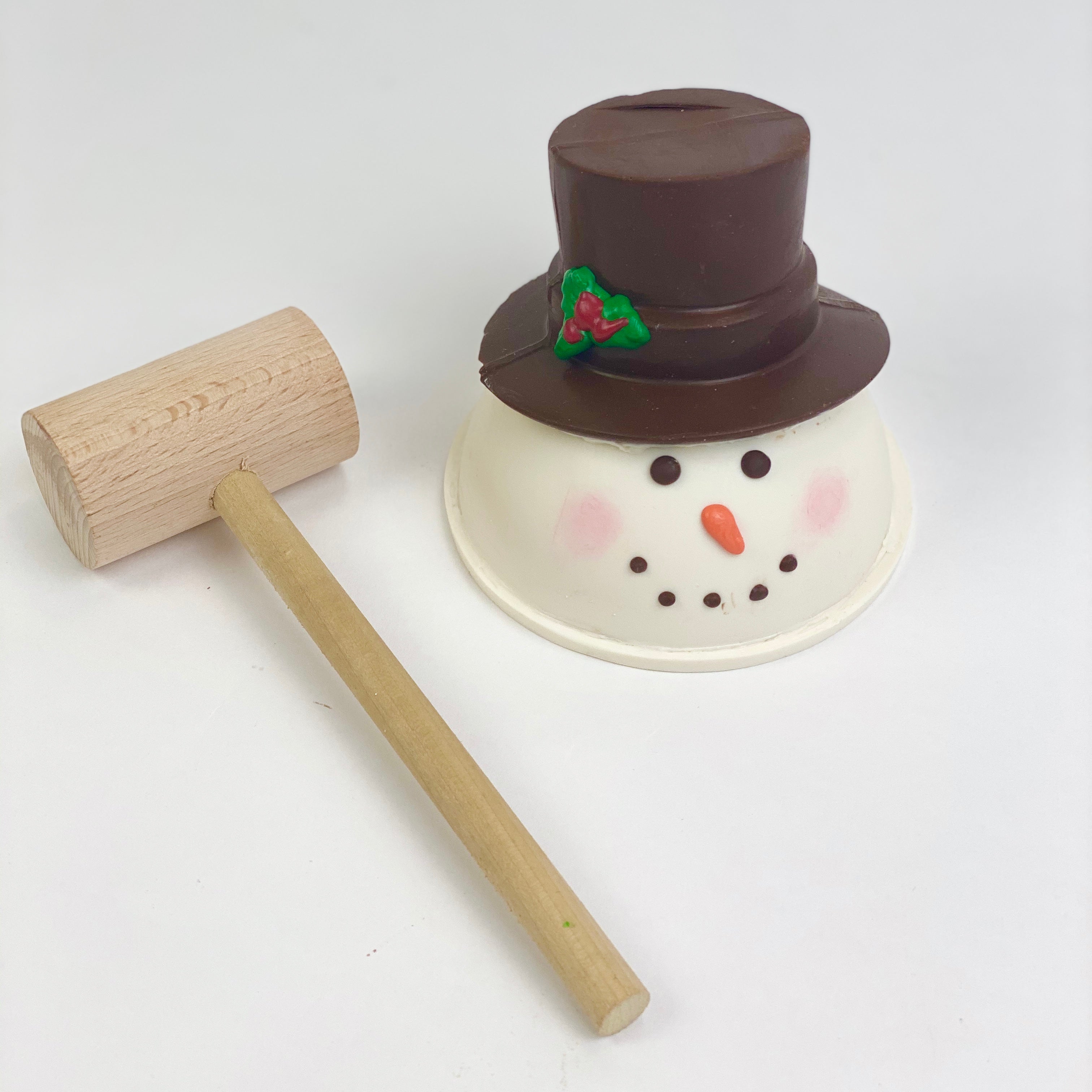 snowman piñata with a mallet