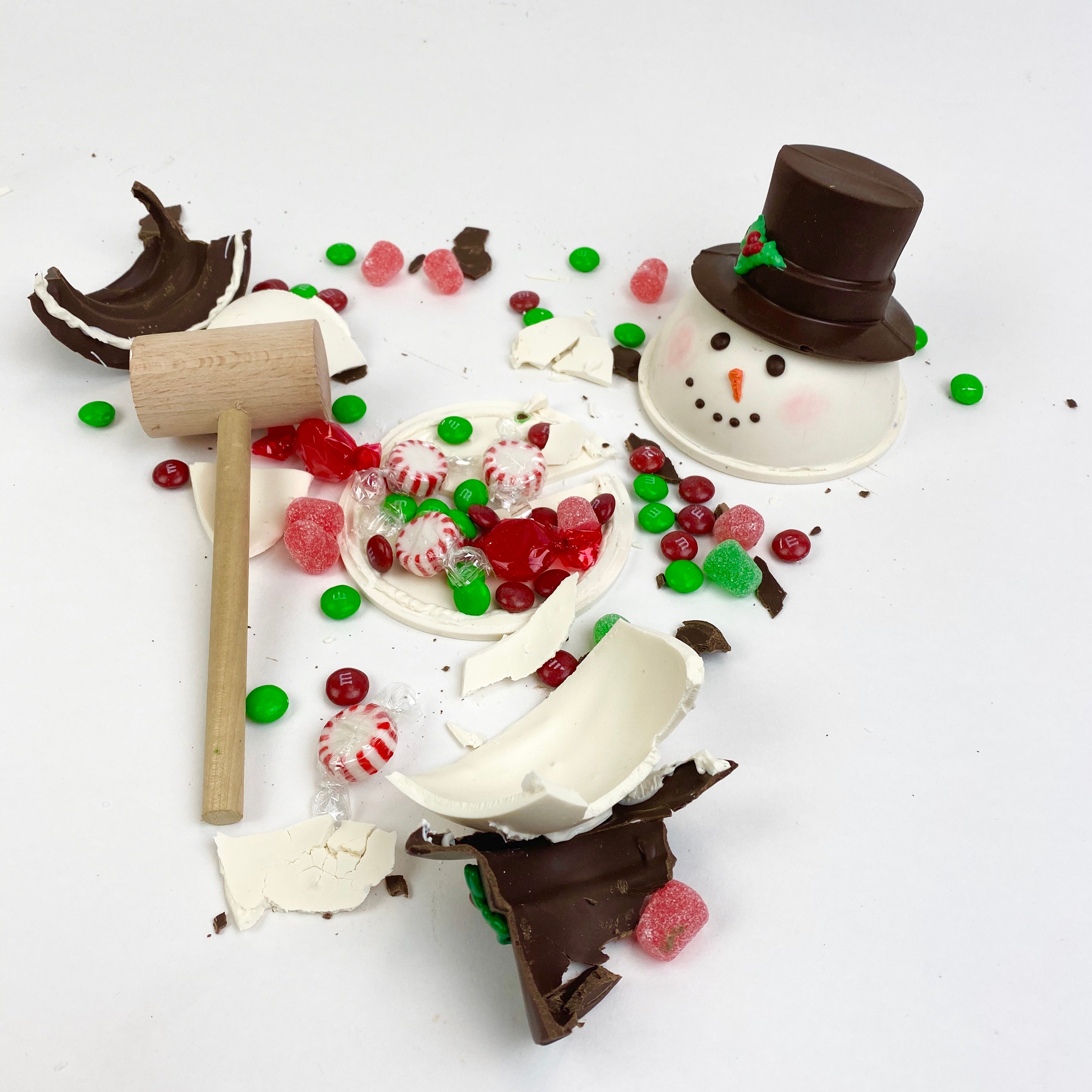 Crushed Snowman Chocolate Pinata with candies and a mallet