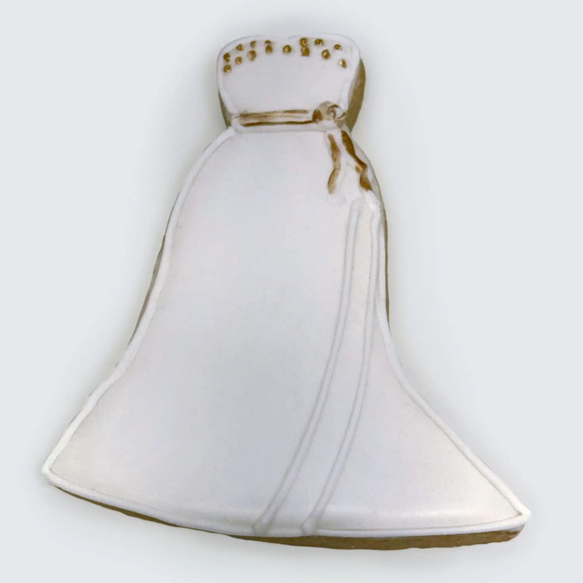 White wedding dress sugar cookie decorated with royal icing and gold accents