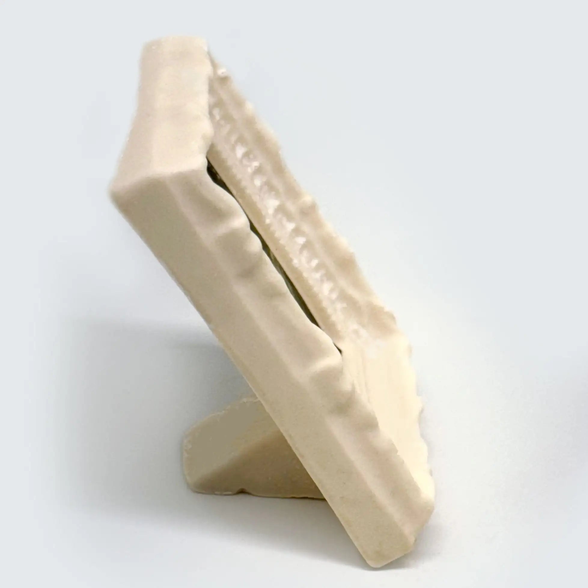 Side view of a white chocolate frame with accents in white
