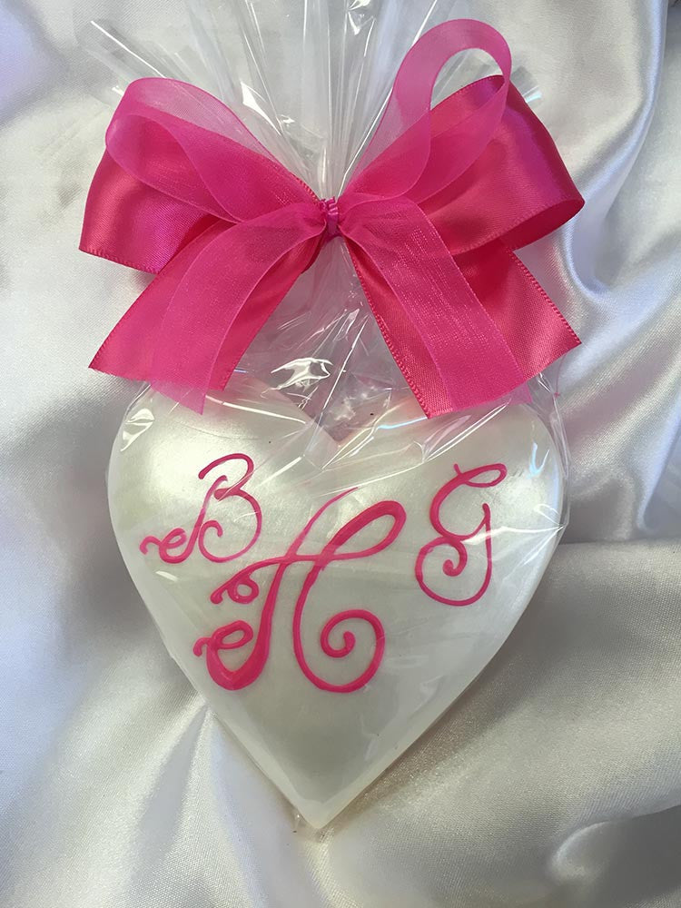 Monogram Pearlized Heart wrapped in cellophane with a ribbon