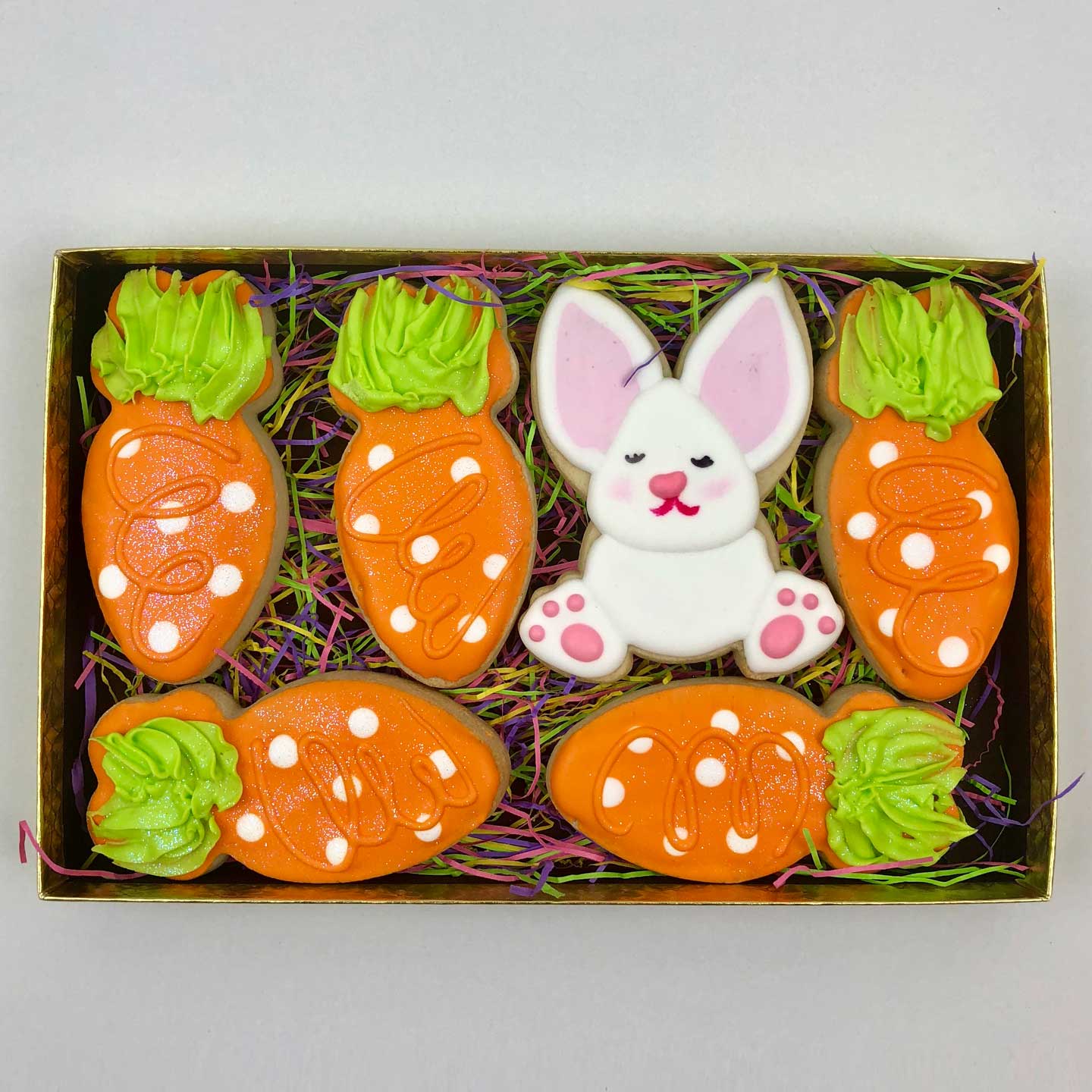 One white Bunny & five orange Carrot cookies with white dots in a box