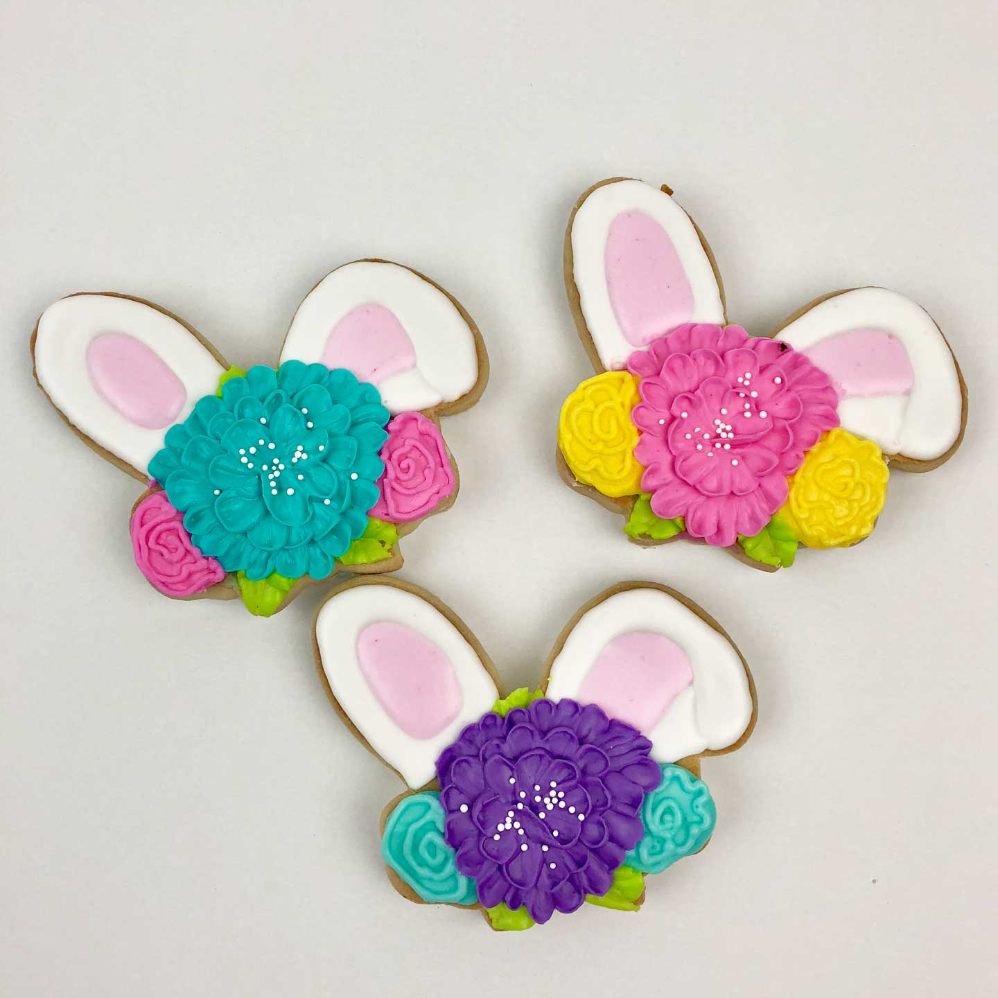 Three blue, pink, and lavender Bunny Ear Cookies