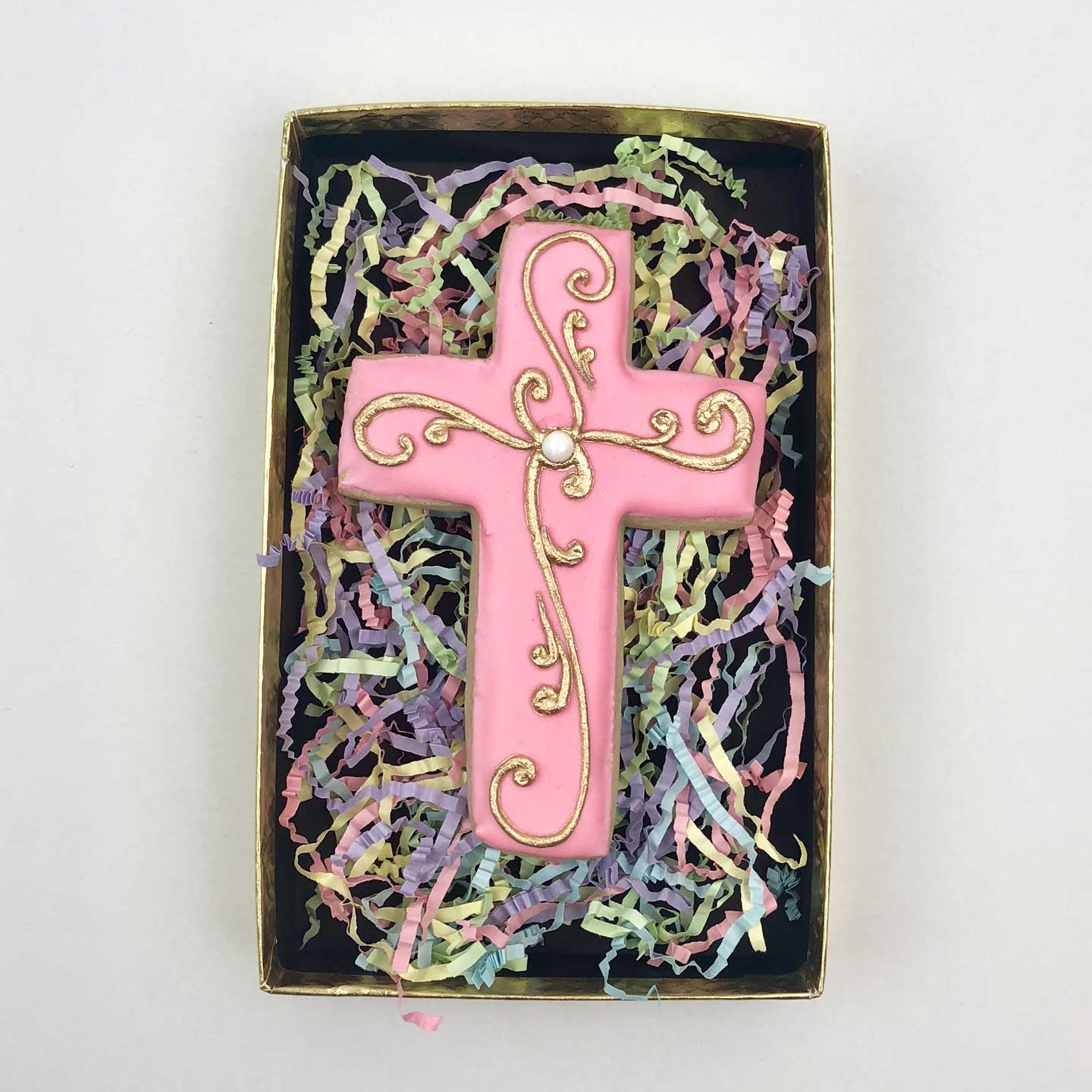Decorated pink Cross Cookie in a box
