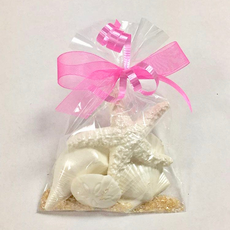 White Chocolate Shells and sand sugar wrapped in cellophane with ribbons