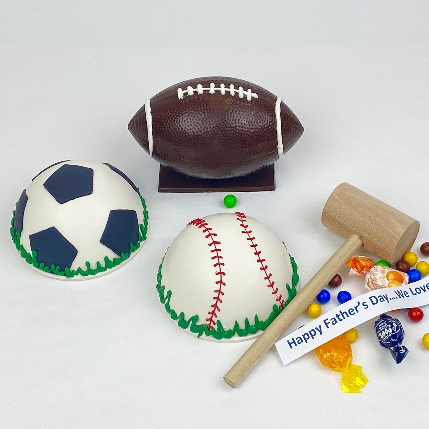 A mallet, baseball, football, soccer ball Piñata filled with candy