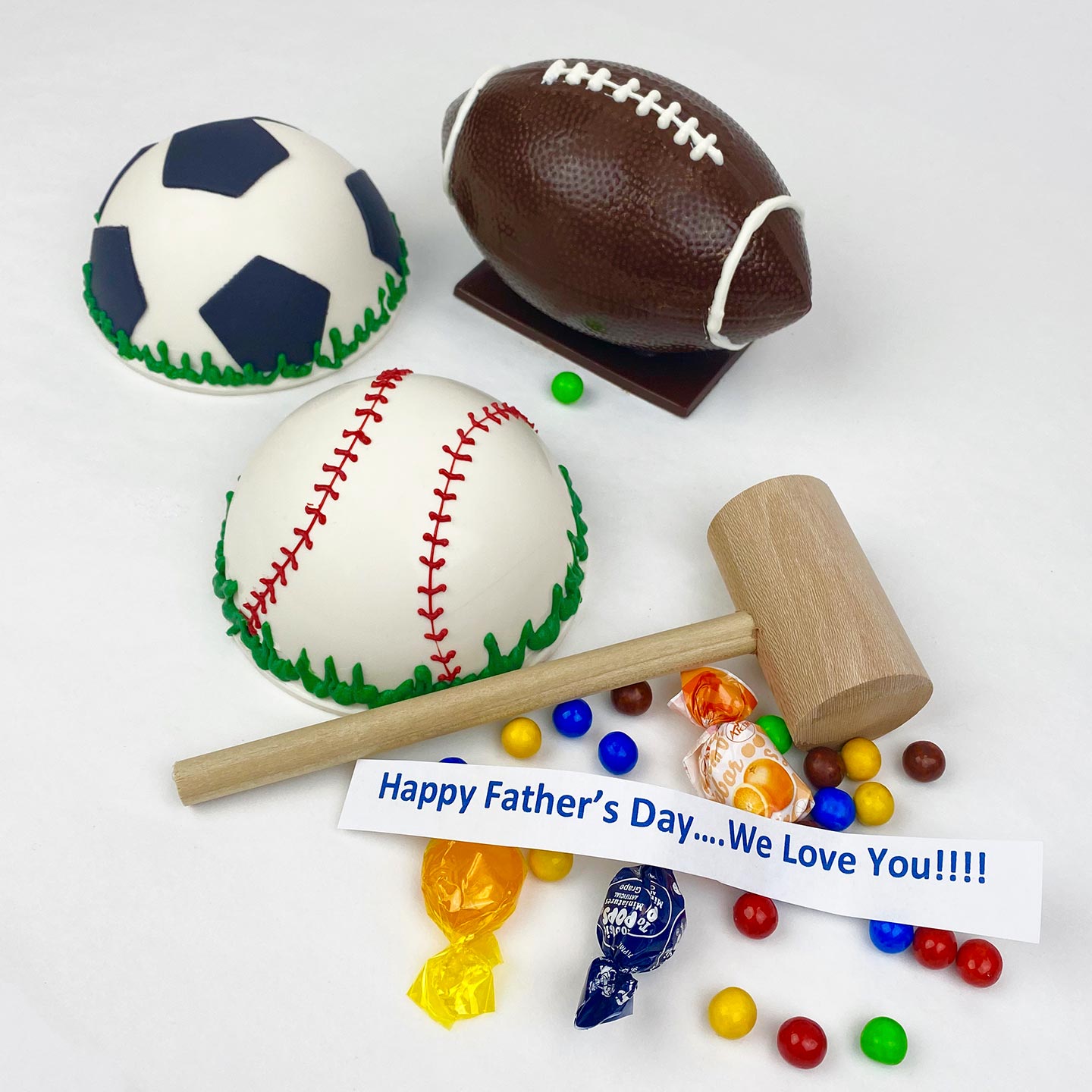 A mallet, baseball, football, soccer ball Piñata filled with candy