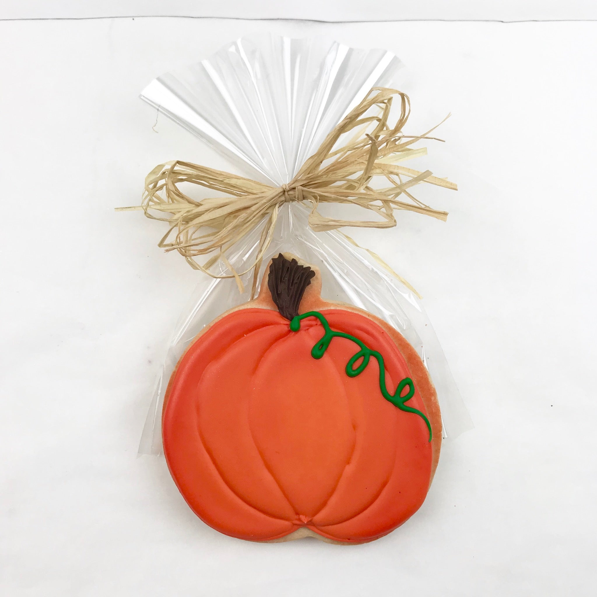 Orange Pumpkin Sugar Cookie, 4” wrapped in cellophane with a ribbon